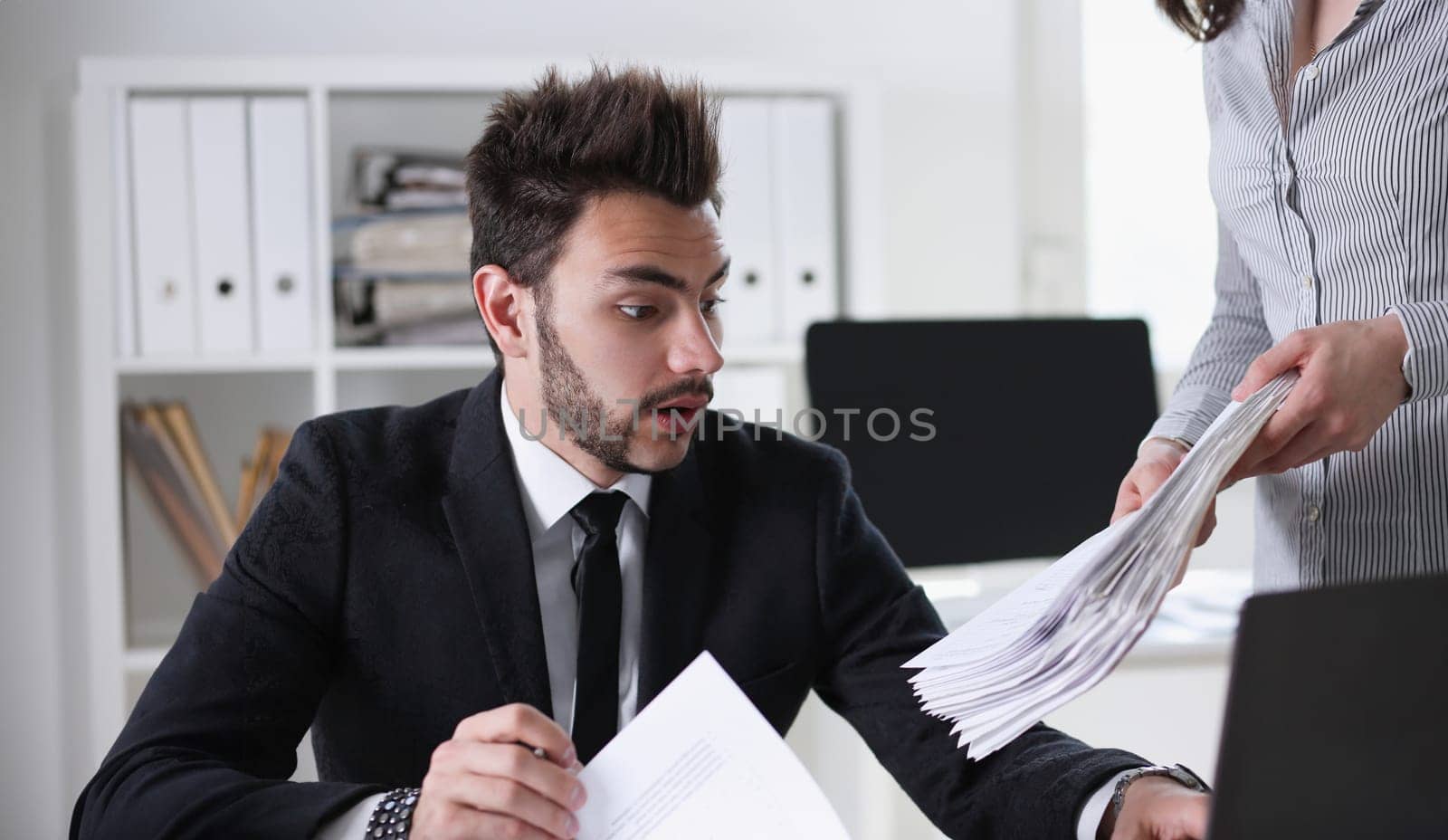 businessman have lot of work with documents. He rush have no time
