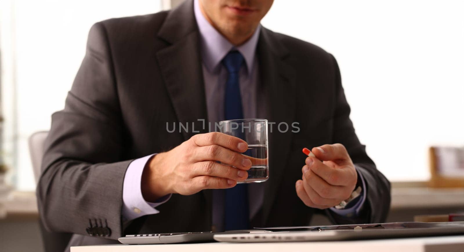 Adult male businessman hold tablet on by kuprevich