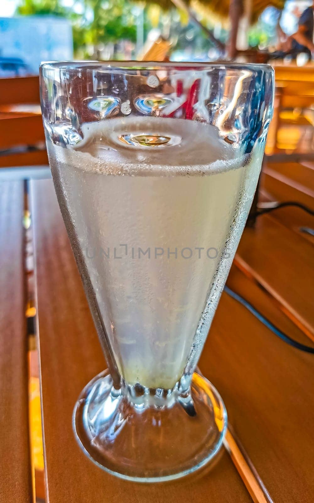 Glass with lime mint and ginger juice in Zicatela Puerto Escondido Oaxaca Mexico.