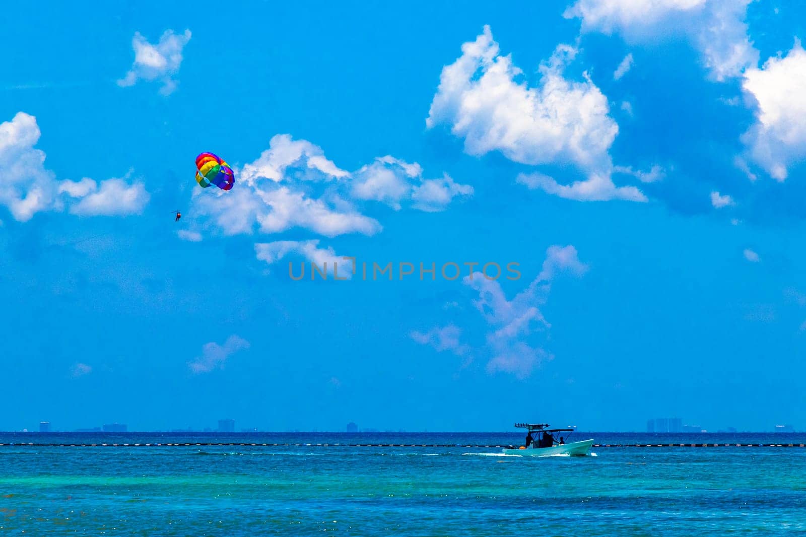 Paragliding with boat in the Caribbean in Playa del Carmen Quintana Roo Mexico.