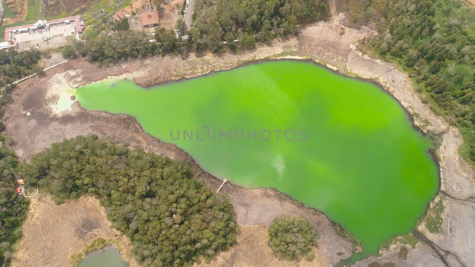 volcanic sulfur lake telaga warna in dieng plateau, java Indonesia. mountain tropical landscape lake with green water among mountains. this lake is one mainstay tourist destinations in Wonosobo Regency