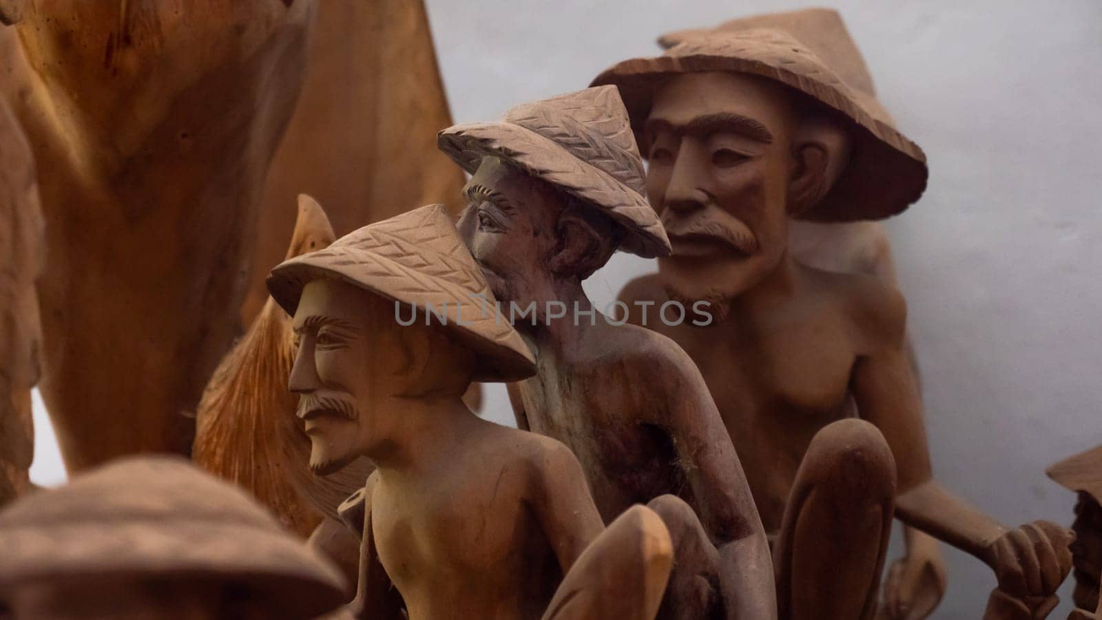 Hindu and Buddhist wooden carving. souvenir shop selling souvenirs and handicrafts of Bali at famous Ubud Market, Indonesia