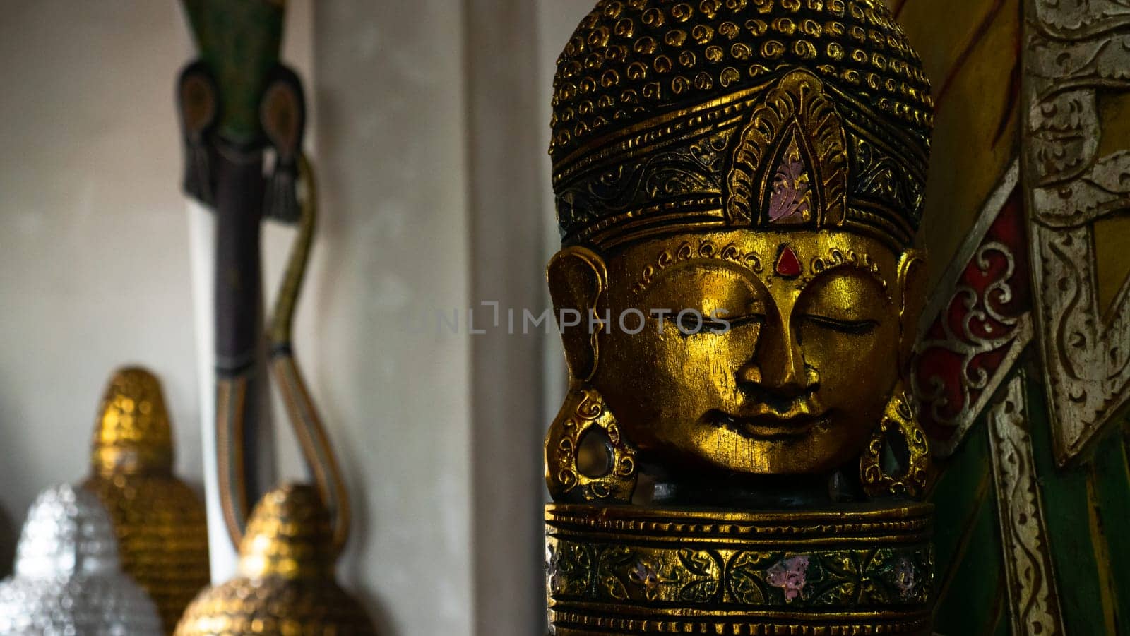 Hindu and Buddhist wooden carving. souvenir shop selling souvenirs and handicrafts of Bali at famous Ubud Market, Indonesia