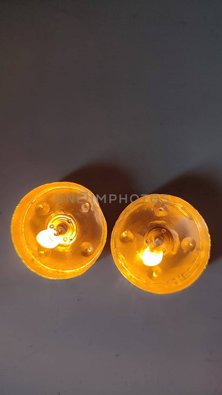 two round candles, fire objects, light . High quality photo