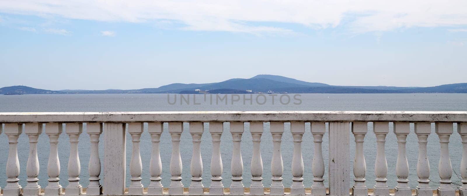 sea view behind the stone white railings of the terrace by Annado