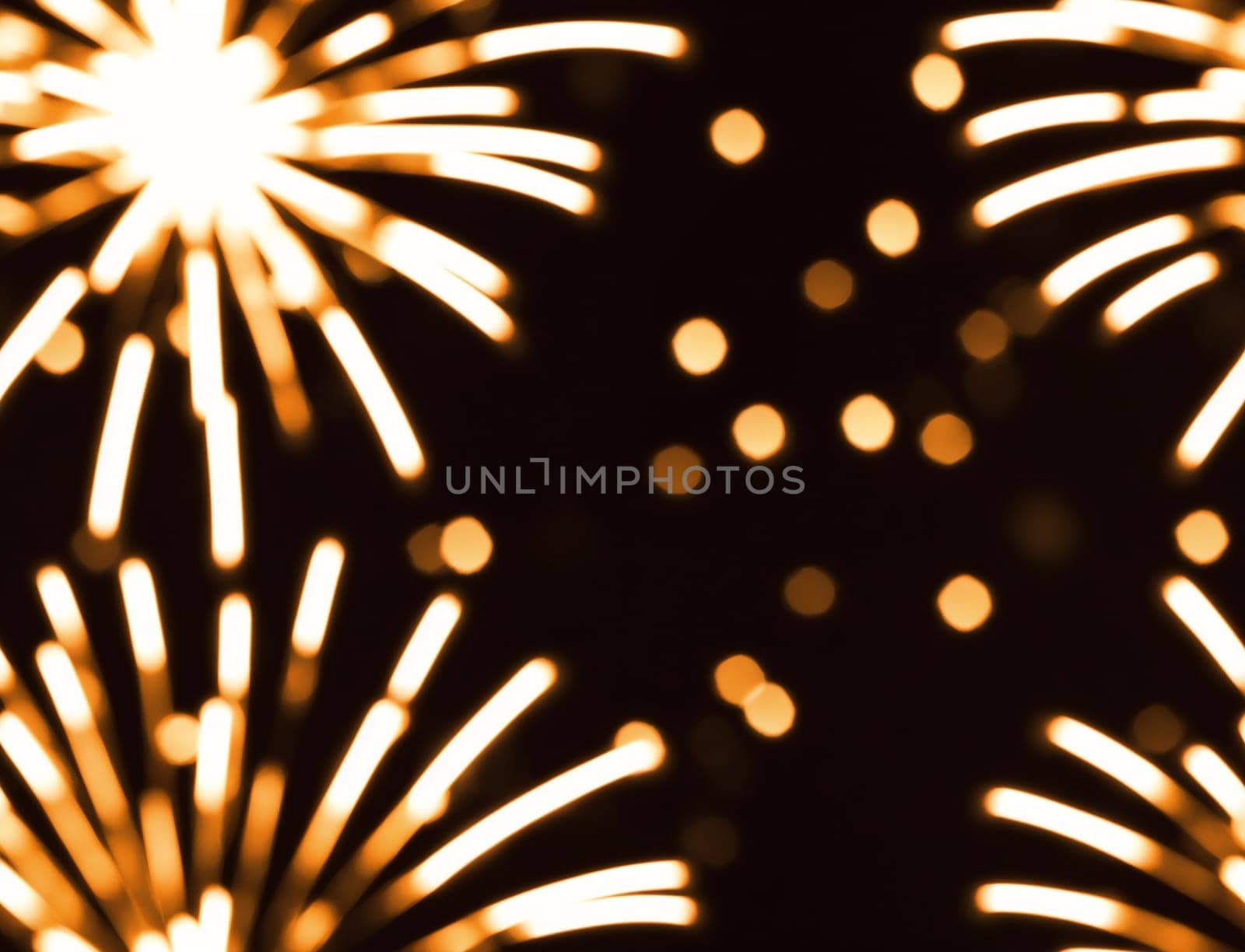 The image is a seamless pattern of golden fireworks in the shape of a circle. - seamless and tileable