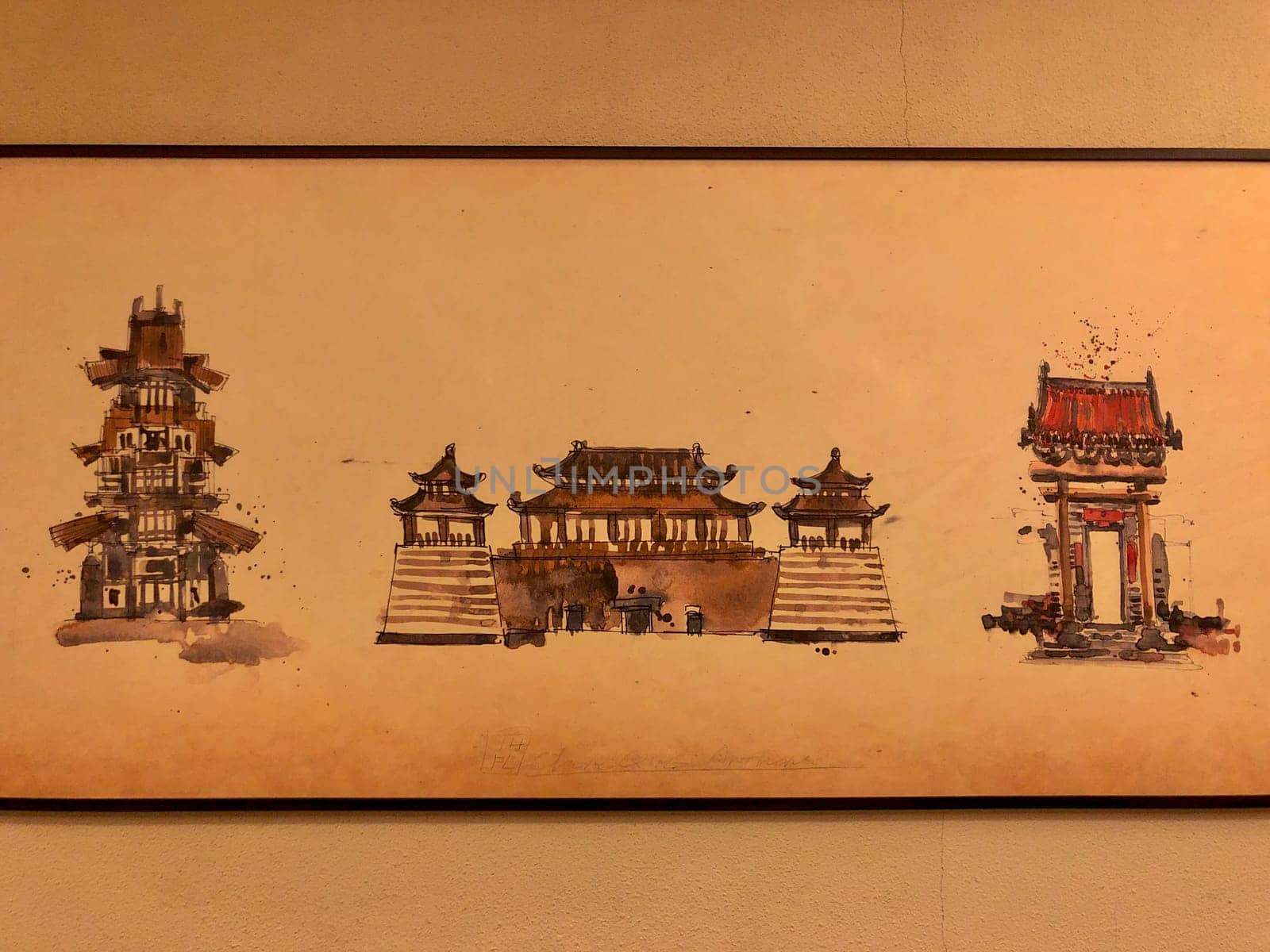 Paintings of classical Chinese buildings are framed and displayed in the living room