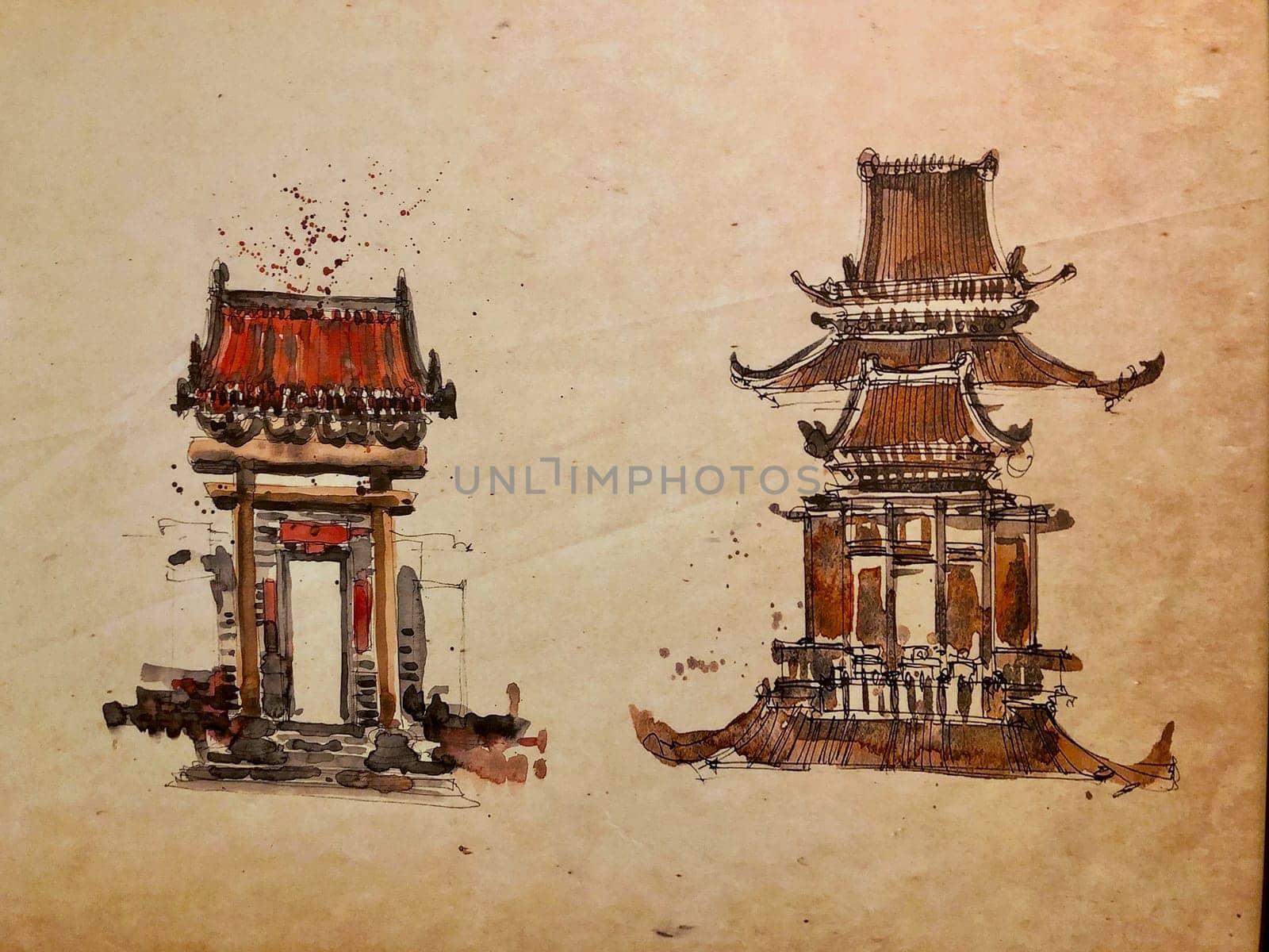 Paintings of classical Chinese buildings are framed and displayed in the living room