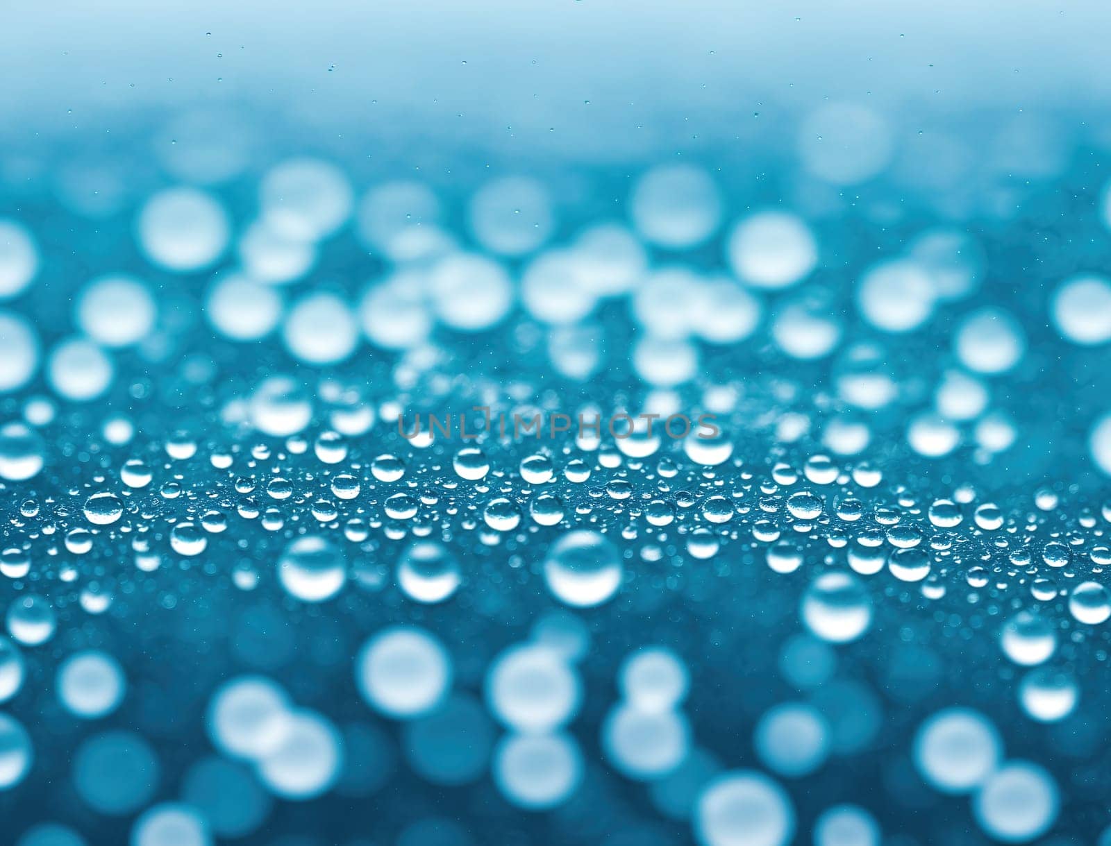 The image is a blue and white background with droplets of water on it.