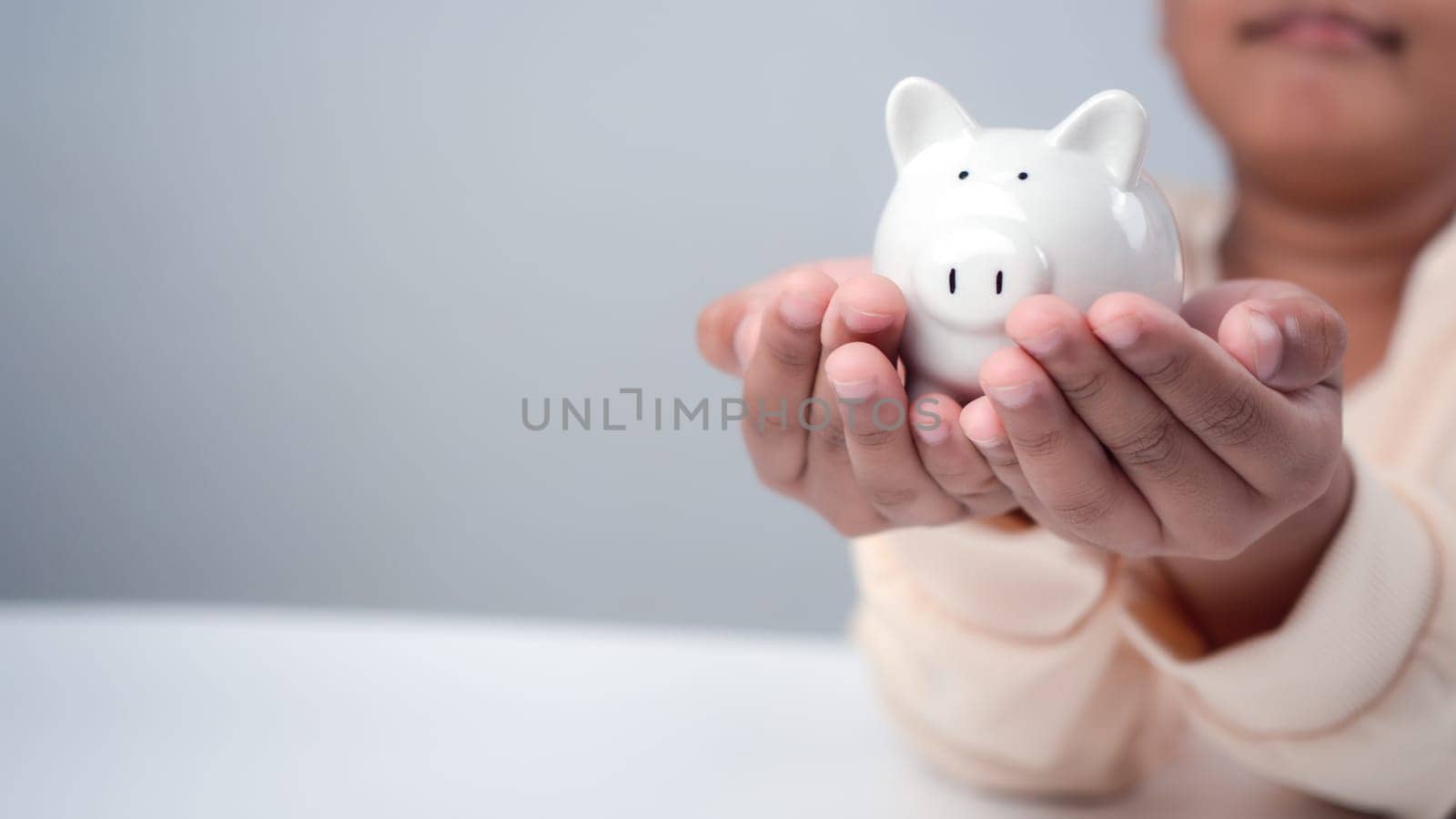 A boy holding piggy bank. Learning financial responsibility and projecting savings. savings concept. investment concept.