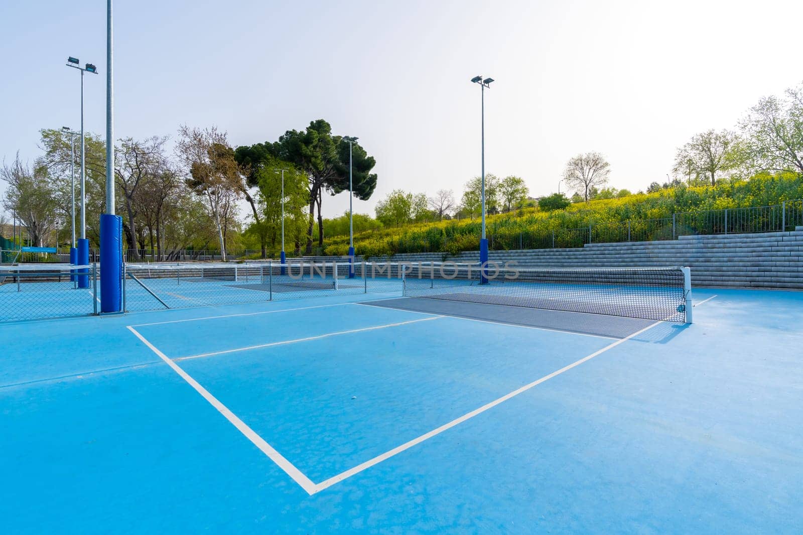 Pickleball outdoors court with no people around by Huizi