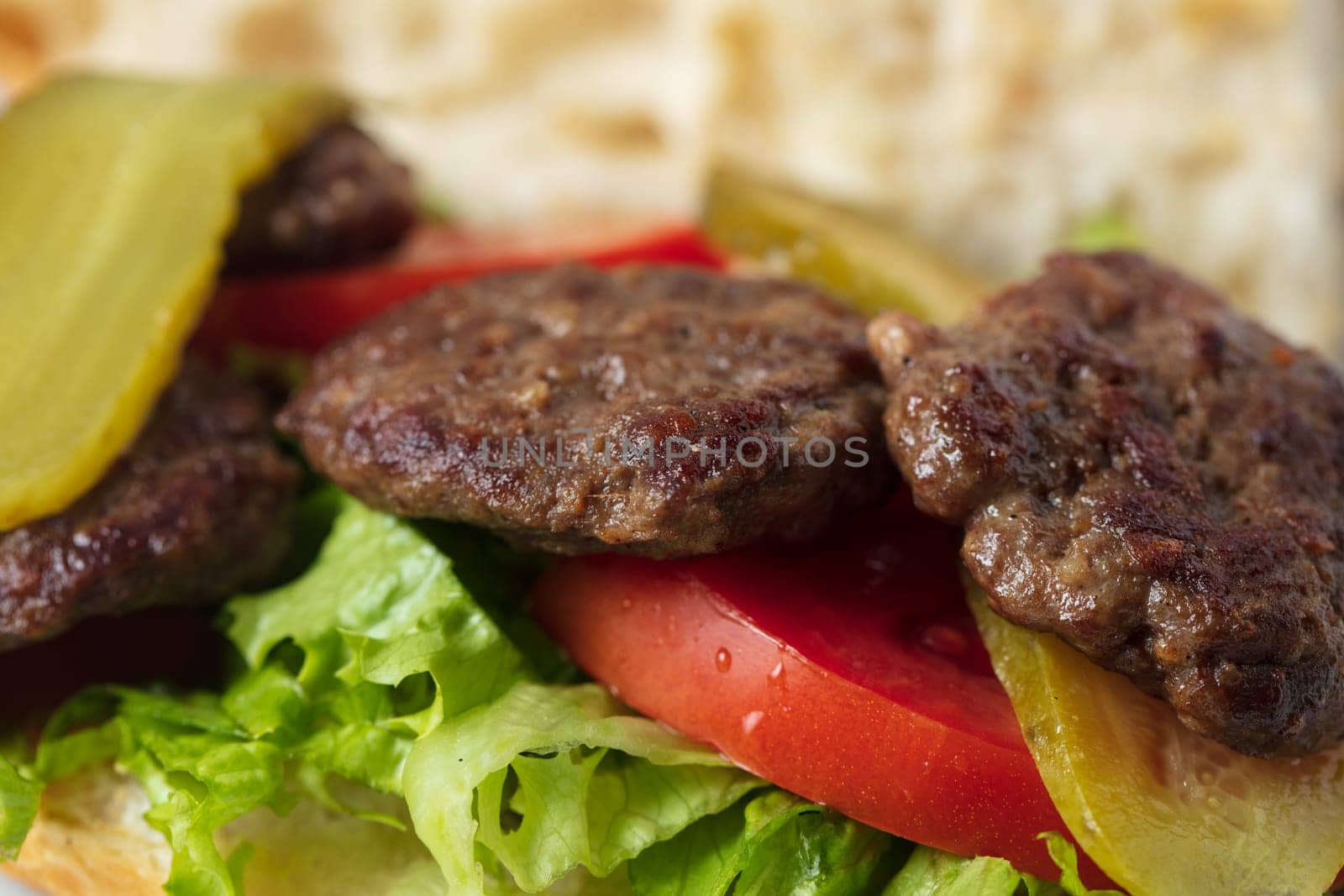 Traditional Turkish meatballs served with French fries tomatoes . High quality photo