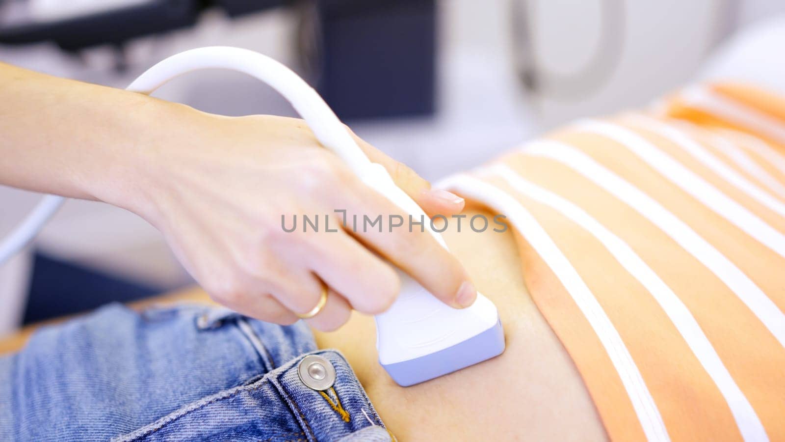 Close up of doctor performing an ultrasound by ivanmoreno