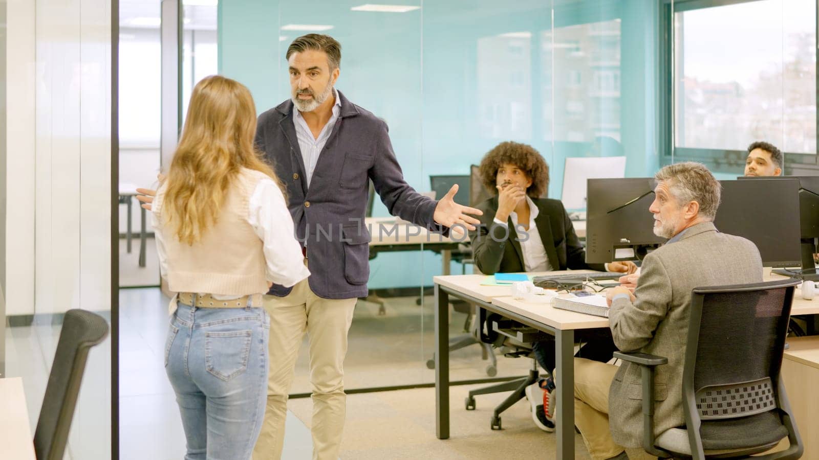 An angry boss shouting at a employee and fire her in front of colleagues