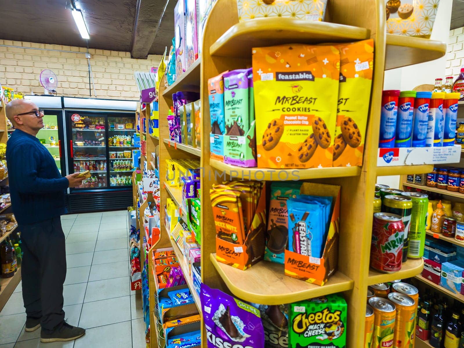 Sokuluk, Kyrgyzstan - April 5, 2024: Chocolate bars and cookies by Mr Beast on small store shelf, his company called Feastables that makes these and other treats