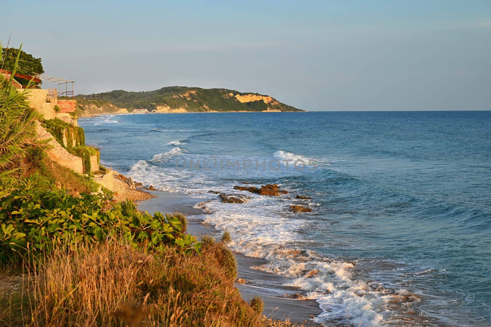 Beautiful beach with sea, sun and blue sky. Concept for travel and summer vacation. Greece-island of Corfu. by Montypeter