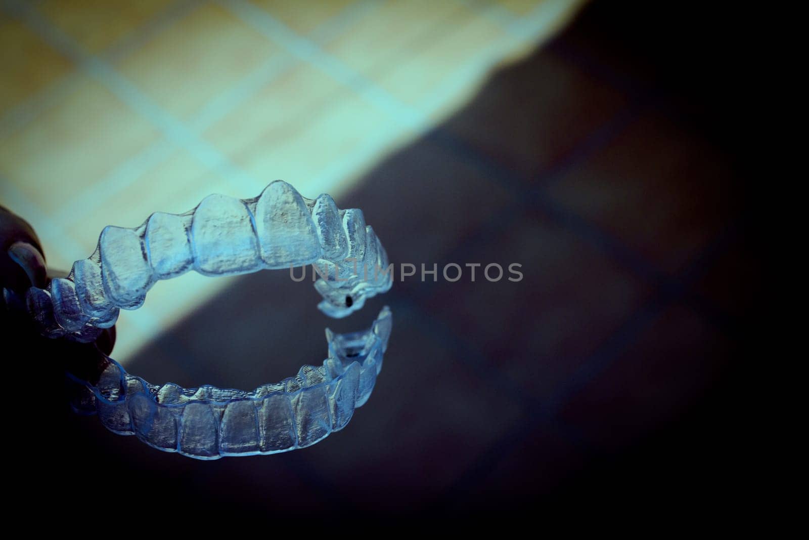 Invisible teeth aligner on light background. No people