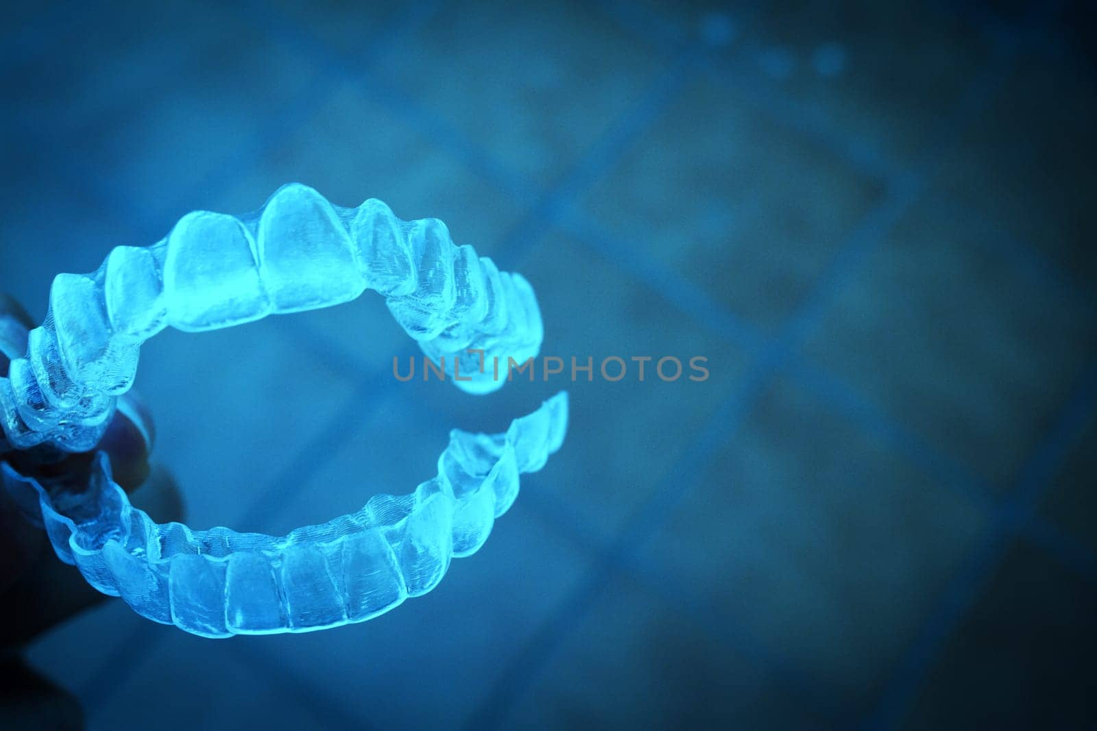 Invisible teeth aligner on light background by GemaIbarra