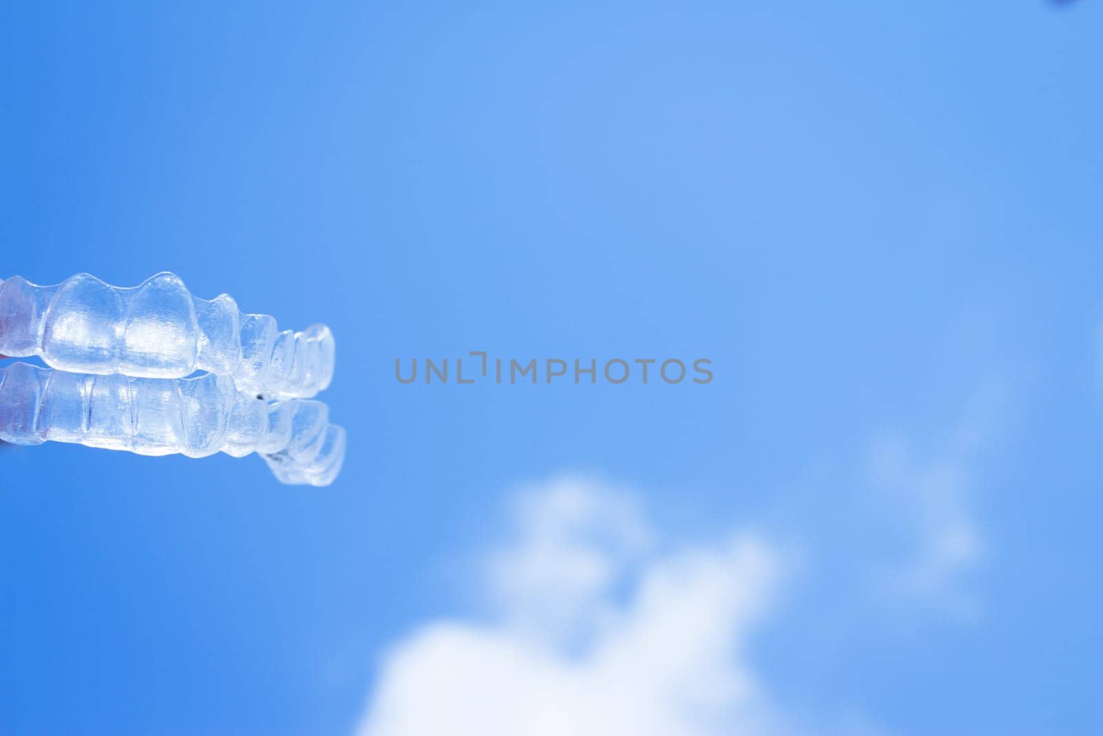 Invisible teeth aligner on light background by GemaIbarra