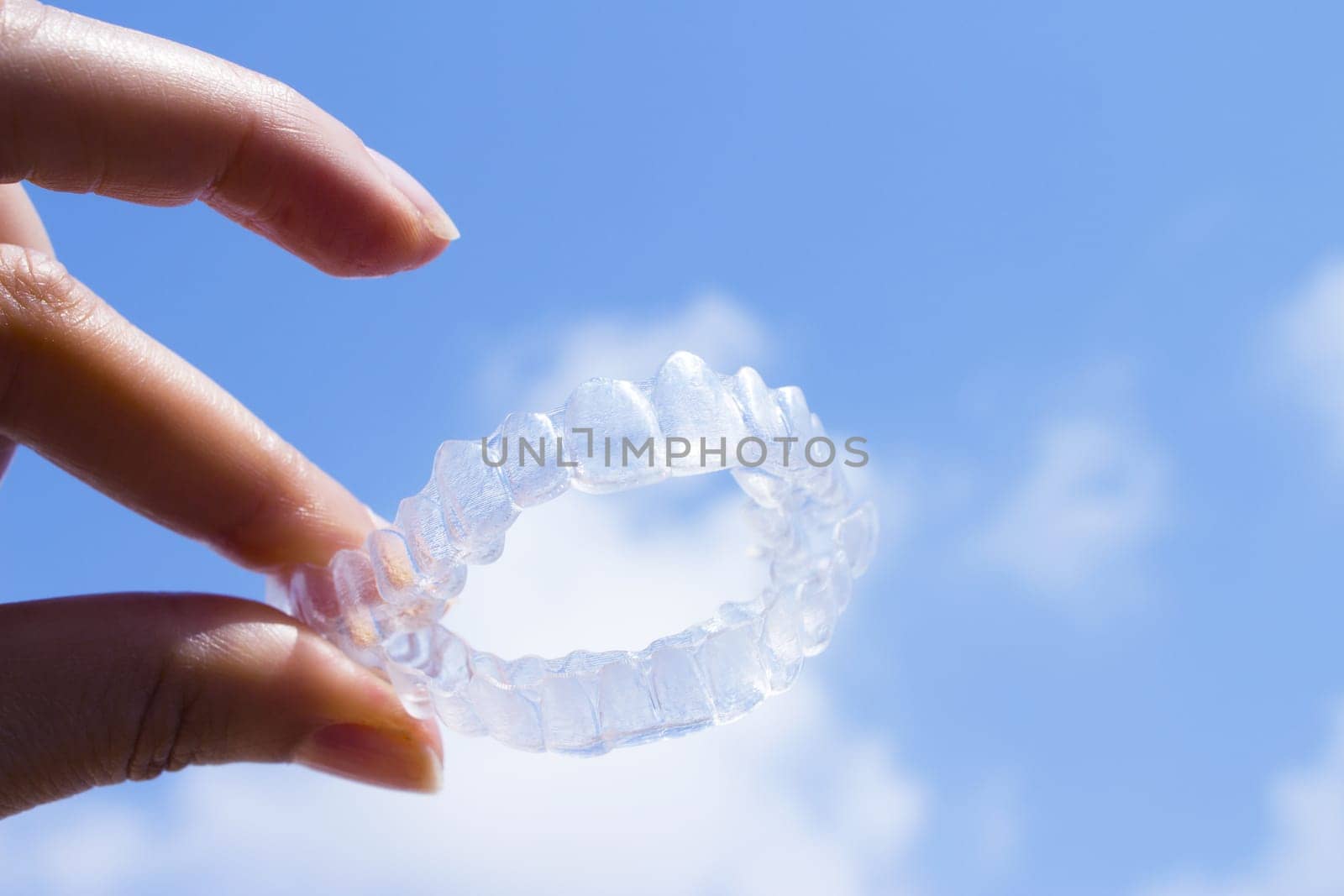 Invisible teeth aligner on light background. No people