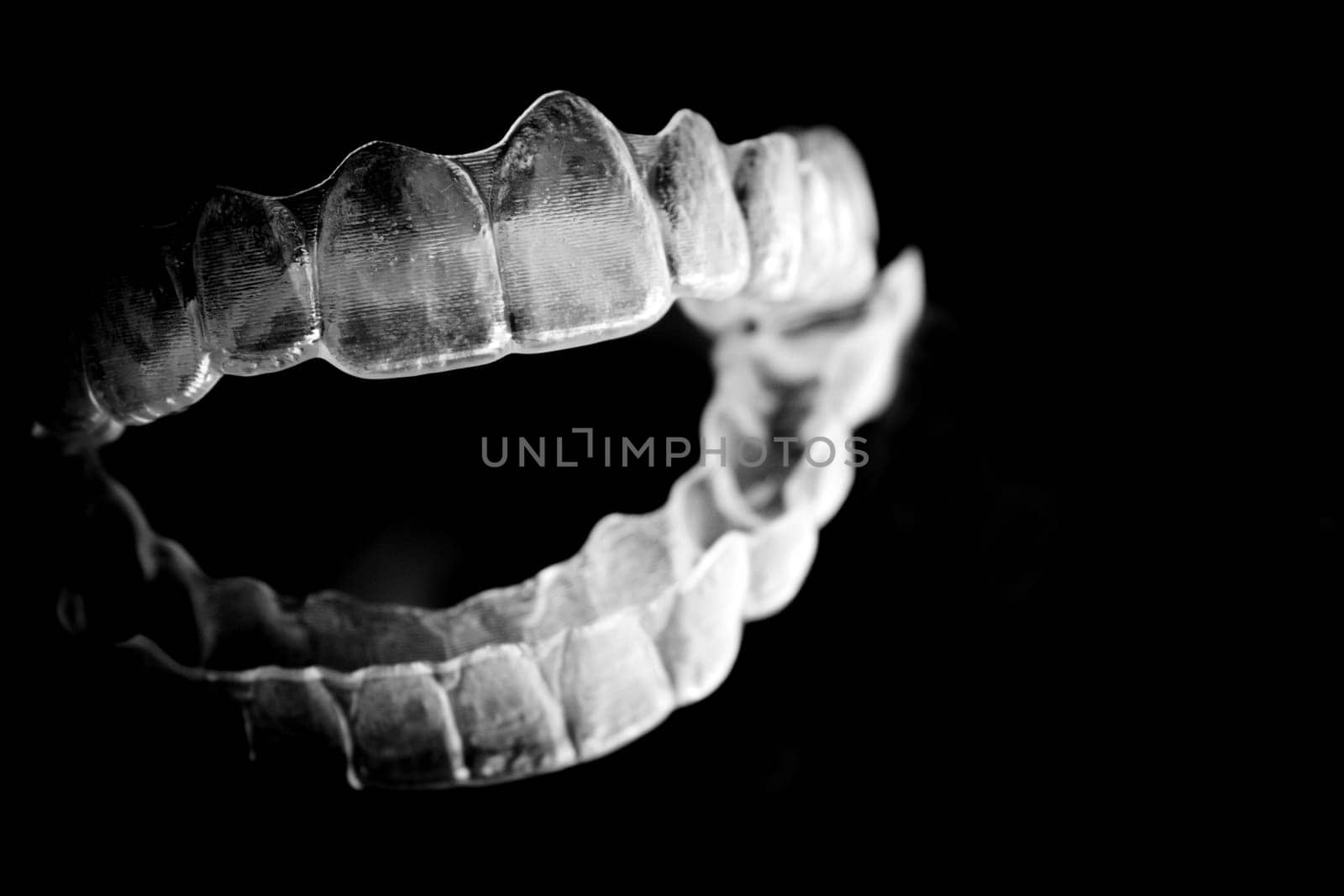 Invisible teeth aligner on light background by GemaIbarra