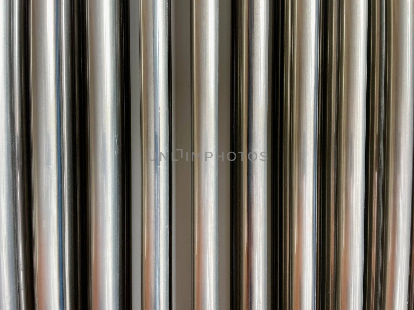Silver background of corrugated metal seamless pipe. High quality photo