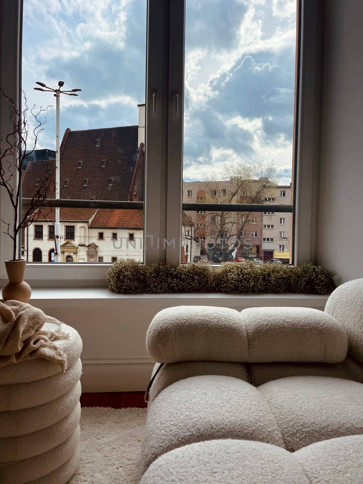 Part of the decoration in the interior, a vase and a view of the city from the window. High quality photo