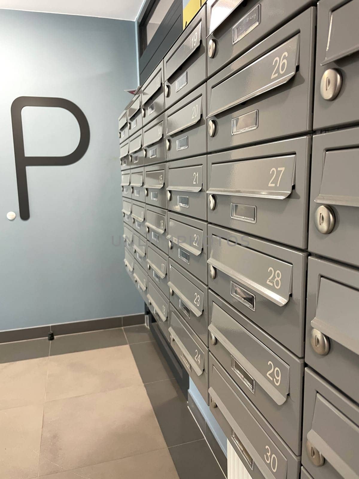 A row of metal mailboxes in a townhouse. High quality photo