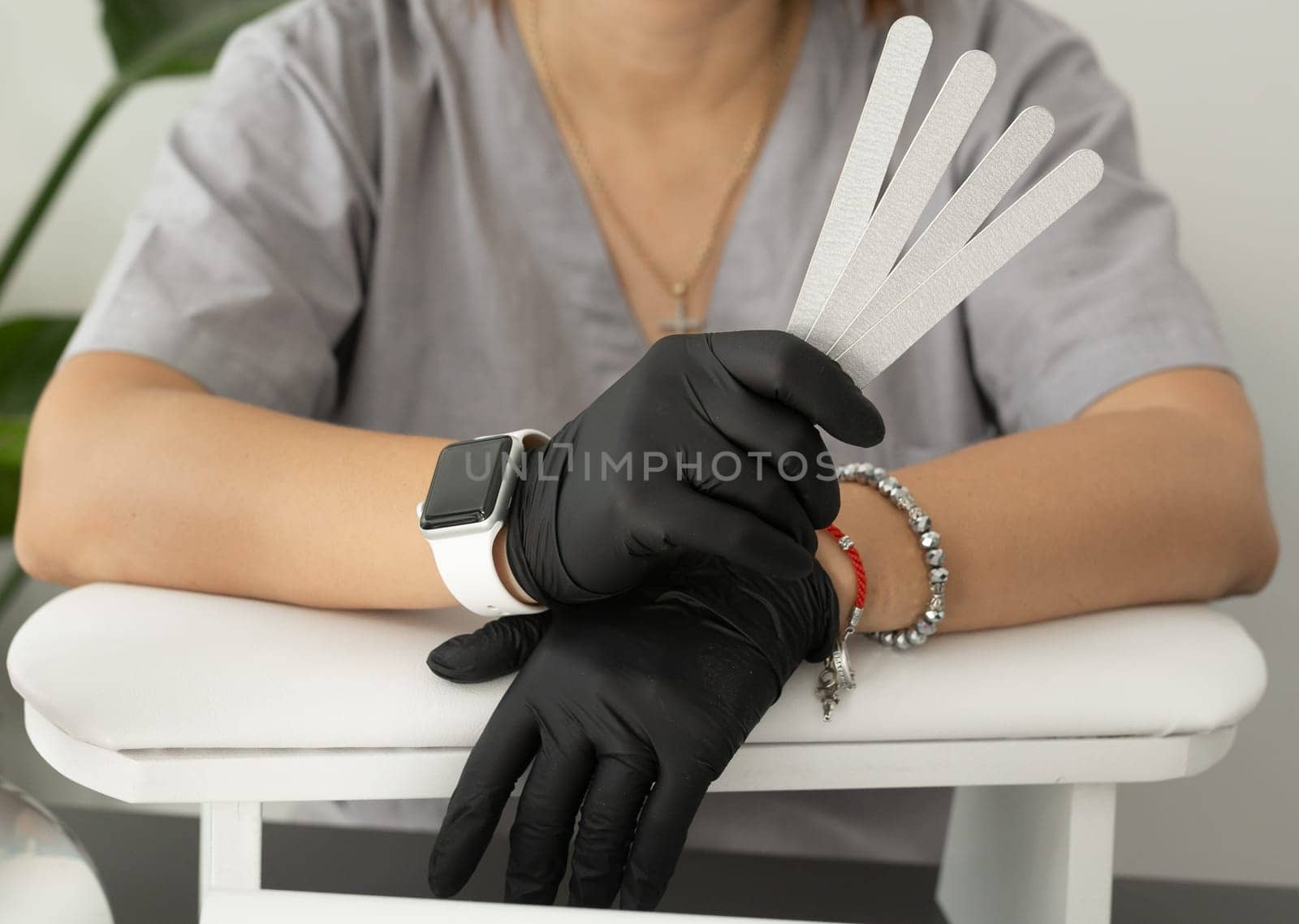 Female hands holds nails files for manicure and pedicure. Concept of polishing nails. Spa treatment beauty