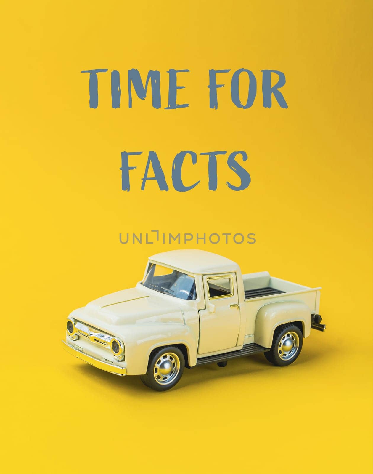 A toy truck is sitting on a yellow background with the words Time for Facts written below it
