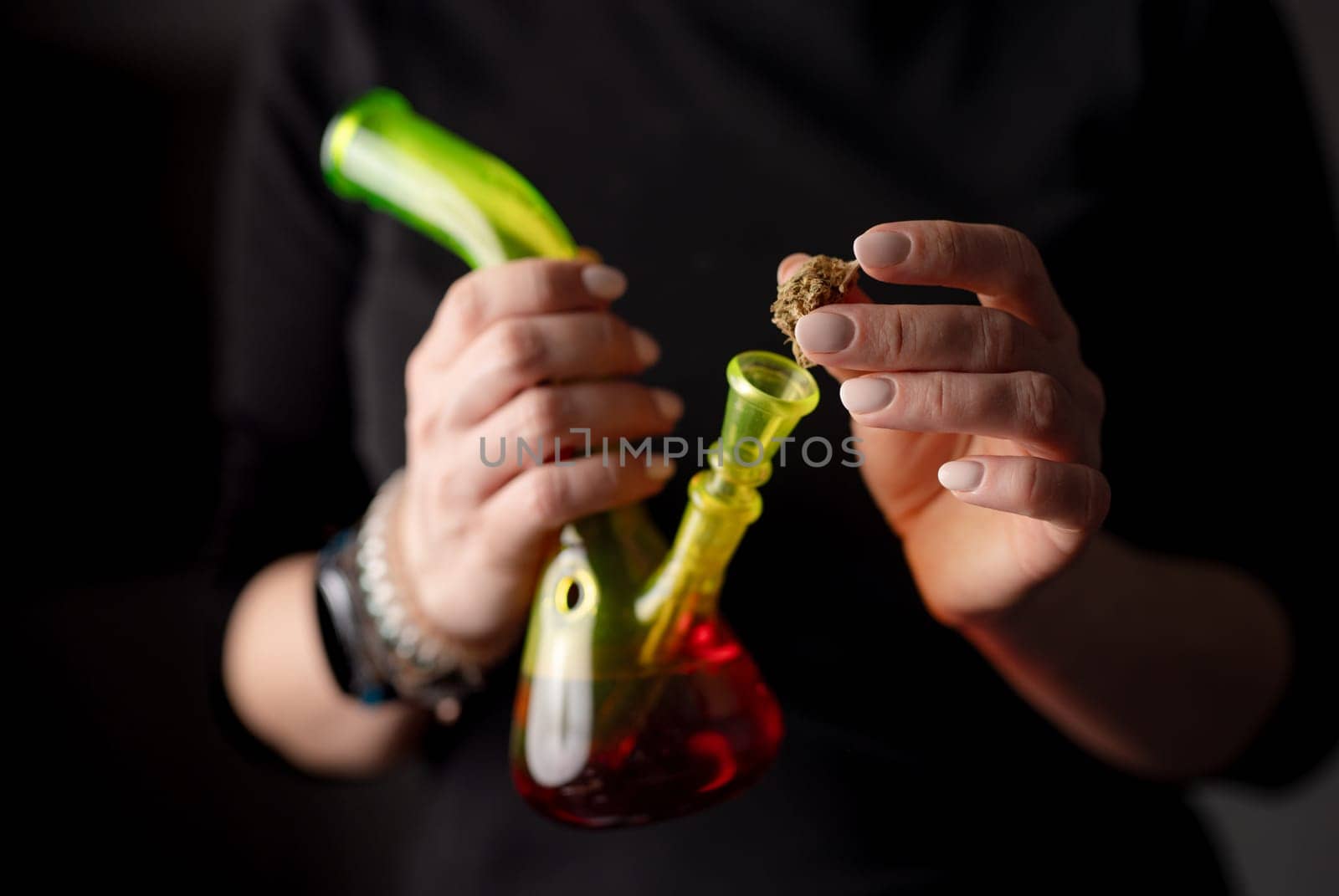 Woman Fills Bong With Cannabis Leaves by tan4ikk1