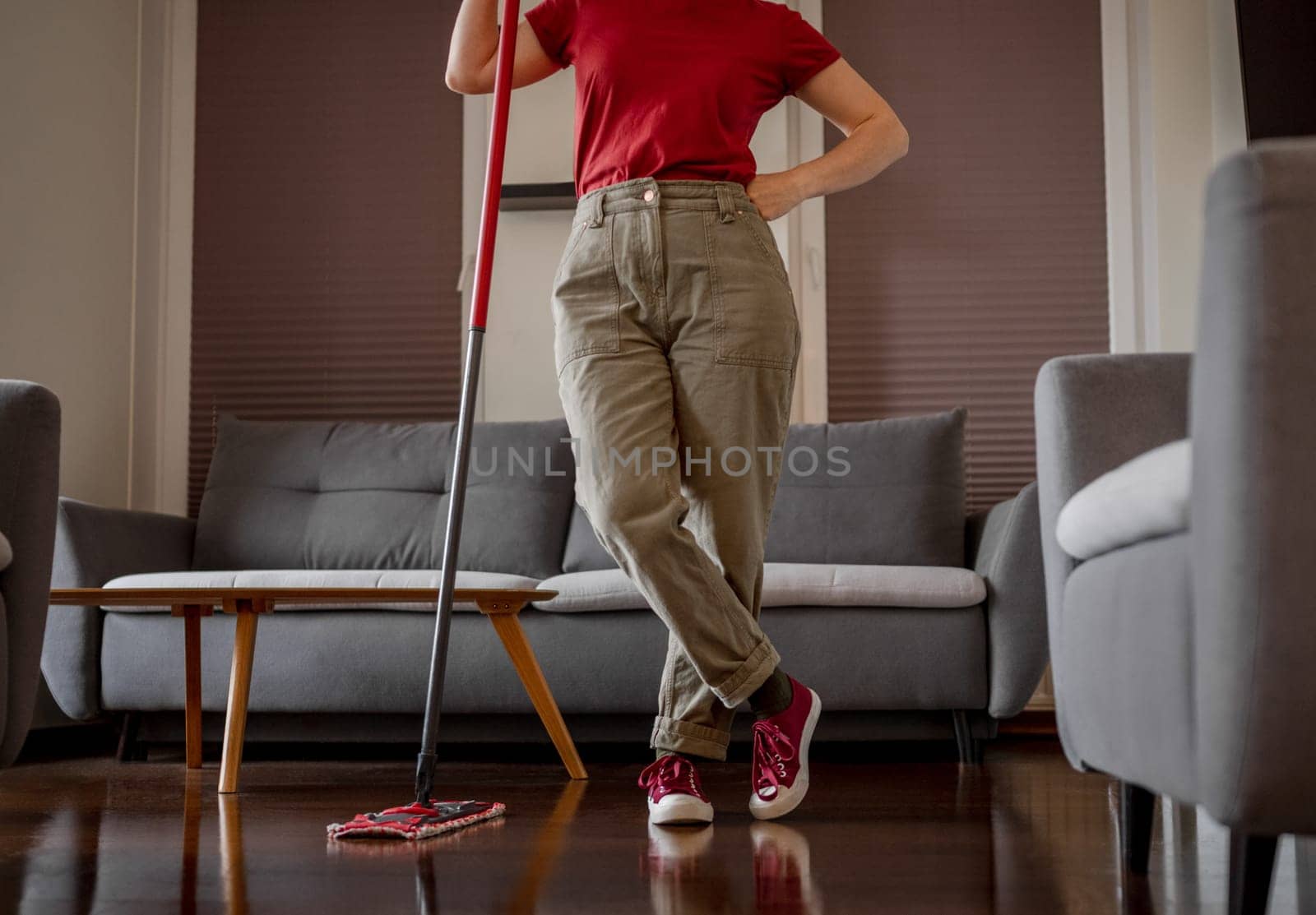 Woman Stands With Mop In Room, Close Up