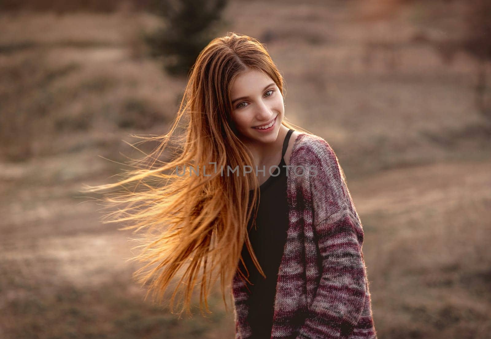 Girl with sun in fluttering hair by tan4ikk1
