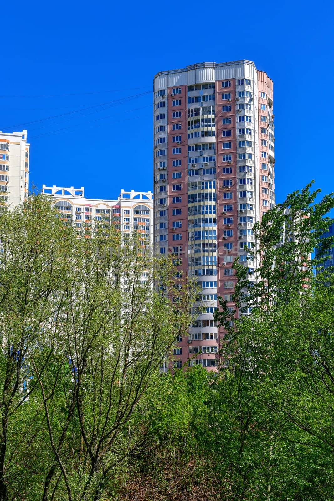 City houses surrounded by trees in the Moscow, Russia