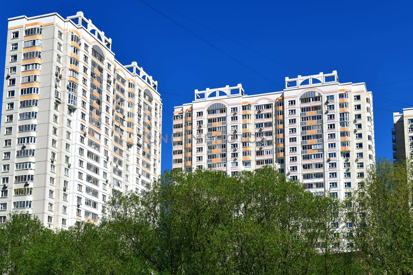 City houses surrounded by trees in the Moscow, Russia