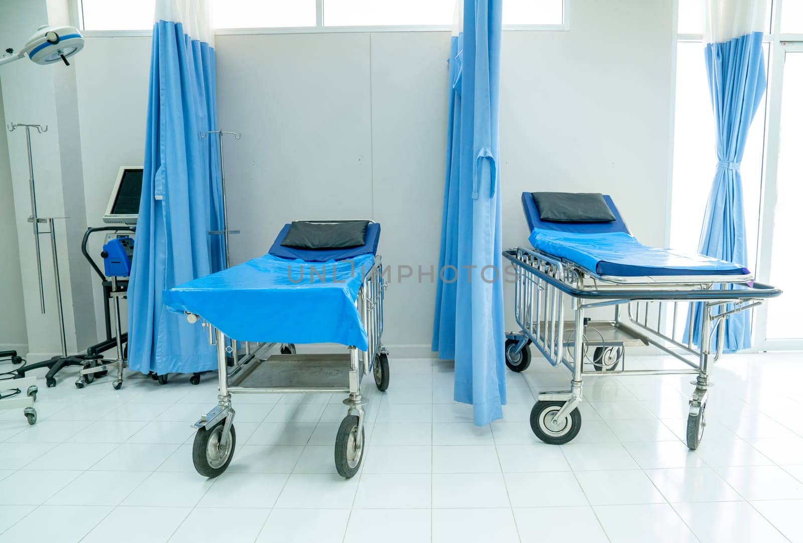 Empty of emergency room with two mobile beds in hospital to support and treatment the patient. by nrradmin