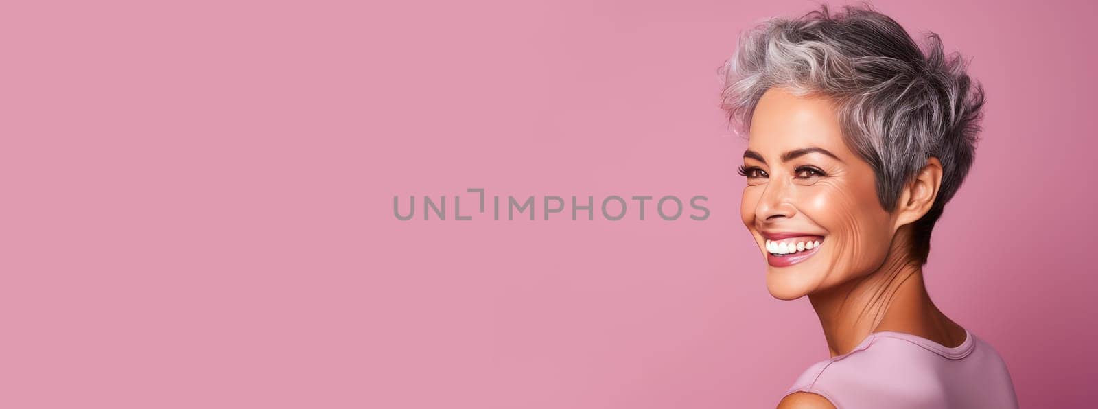 Elegant, smiling elderly, chic latino, Spain woman with gray hair and perfect skin, pink background banner. Advertising of cosmetic products, spa treatments, shampoos and hair care products, dentistry and medicine, perfumes and cosmetology for women