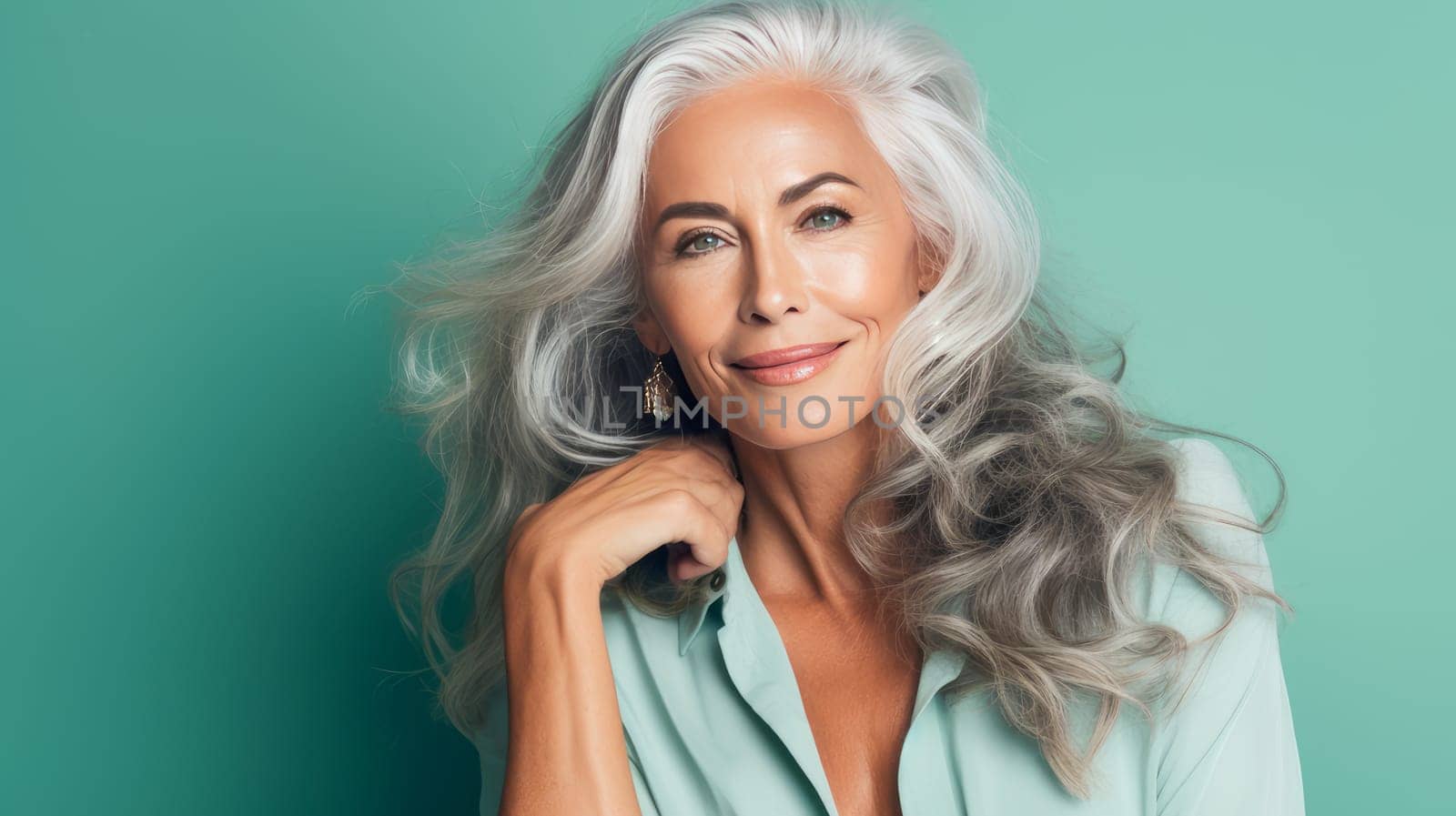 Elegant, elderly, chic latino, Spain woman with gray long hair and perfect skin, green background, banner. Advertising of cosmetic products, spa treatments, shampoos and hair care products, dentistry and medicine, perfumes and cosmetology for women