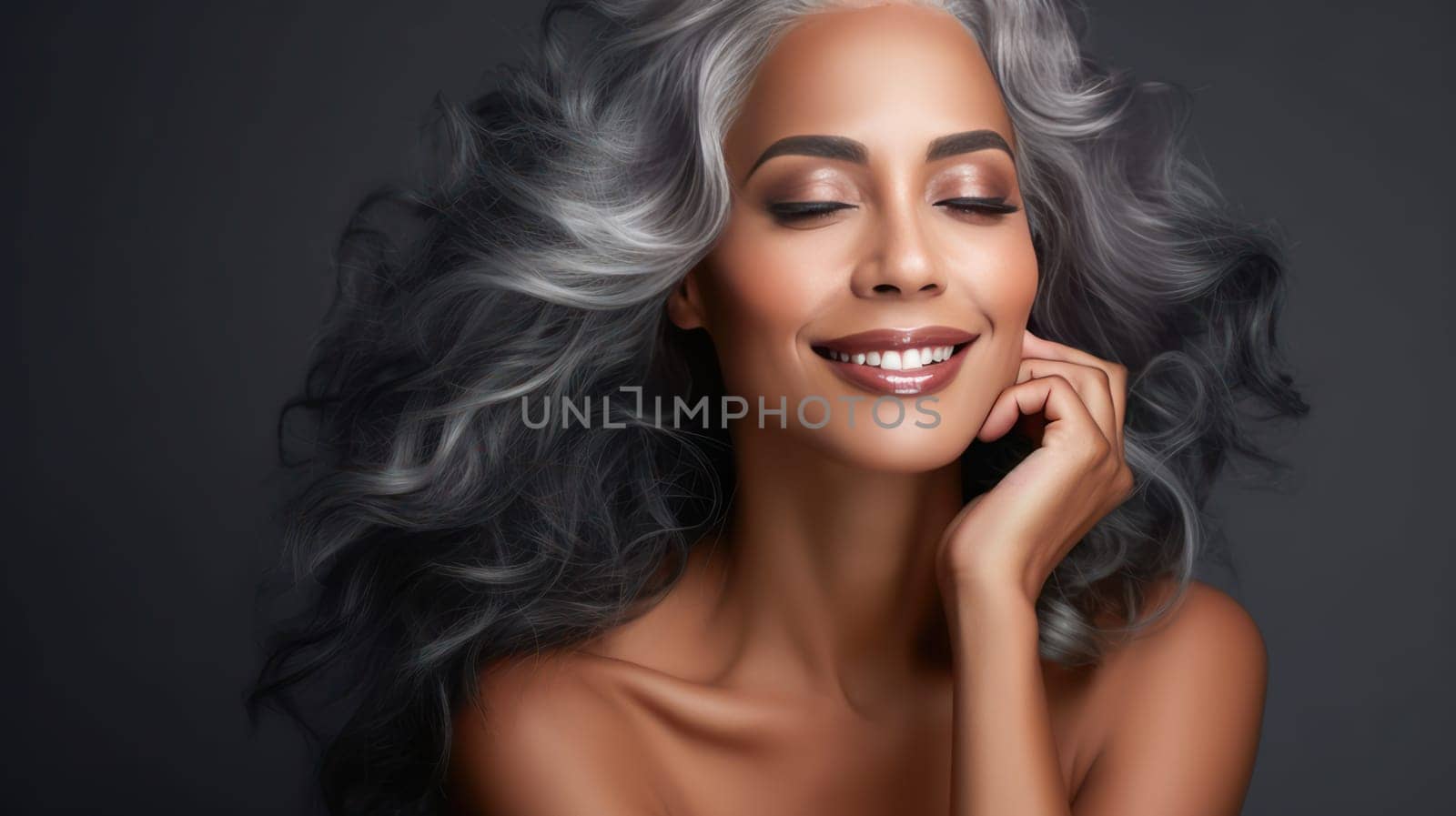 Elegant, elderly, chic latino, Spain woman with gray long hair and perfect skin, gray background, banner. Advertising of cosmetic products, spa treatments, shampoos and hair care products, dentistry and medicine, perfumes and cosmetology for women