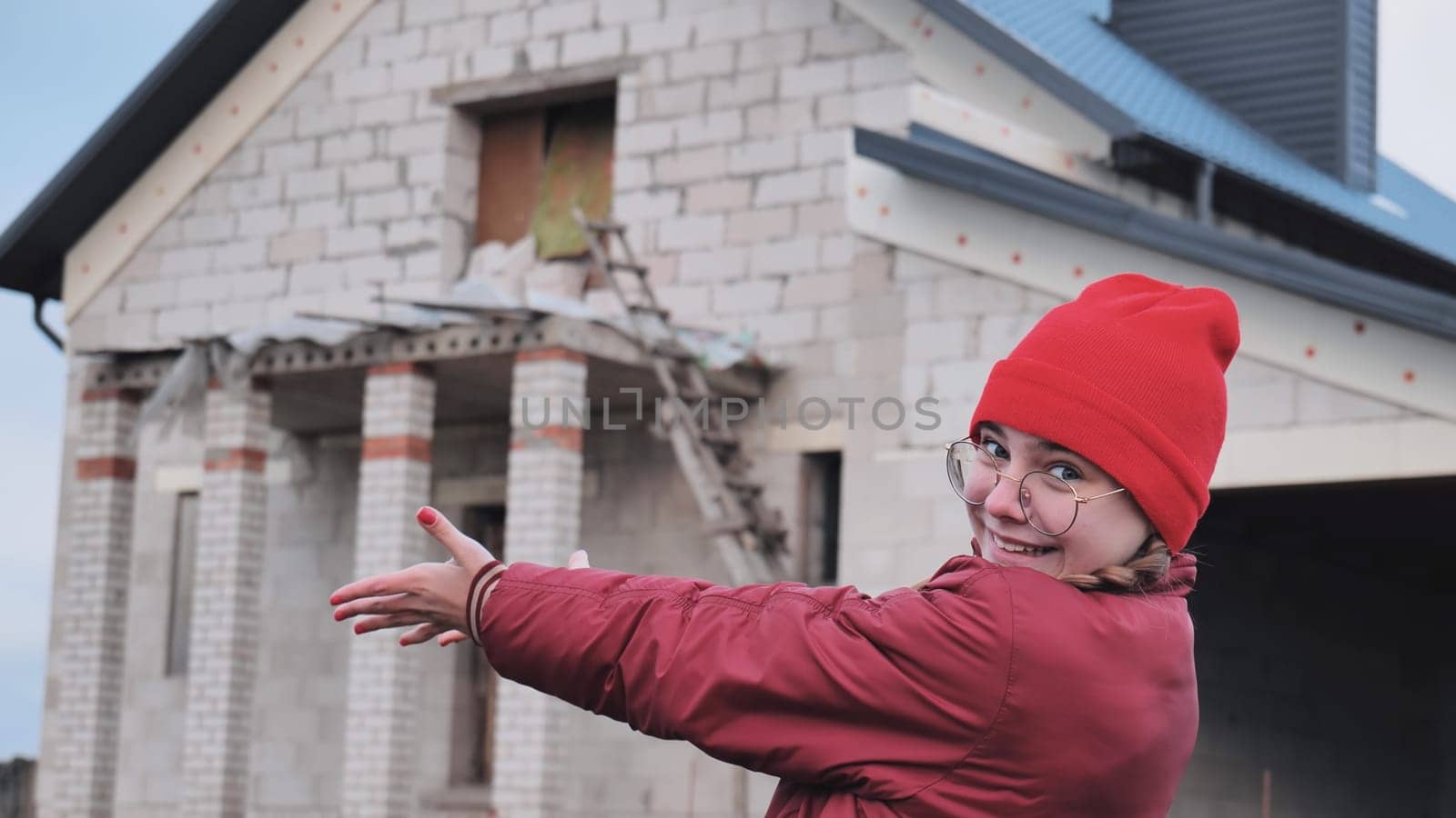The girl is excited about building her future home. by DovidPro