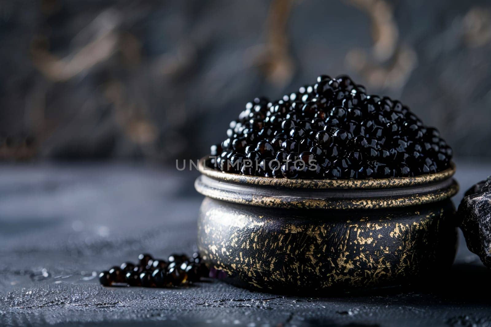 Gourmet black sturgeon caviar presented in decorative vintage bowl, set against a moody, dark textured backdrop, embodying luxury and fine dining.