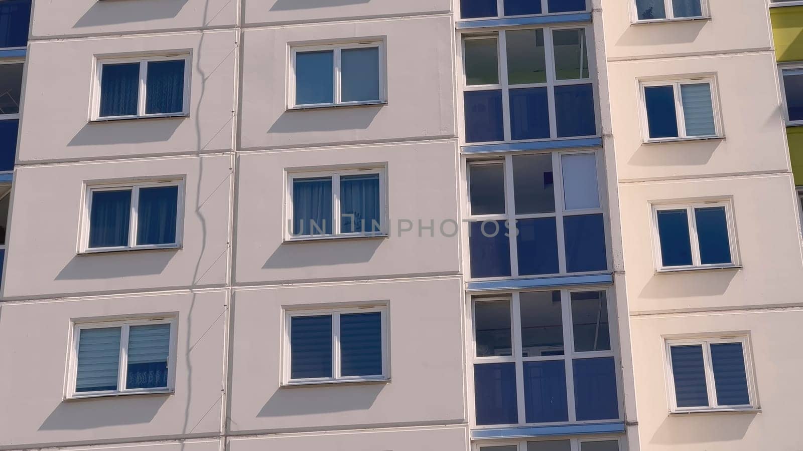The windows of a residential high-rise building. by DovidPro