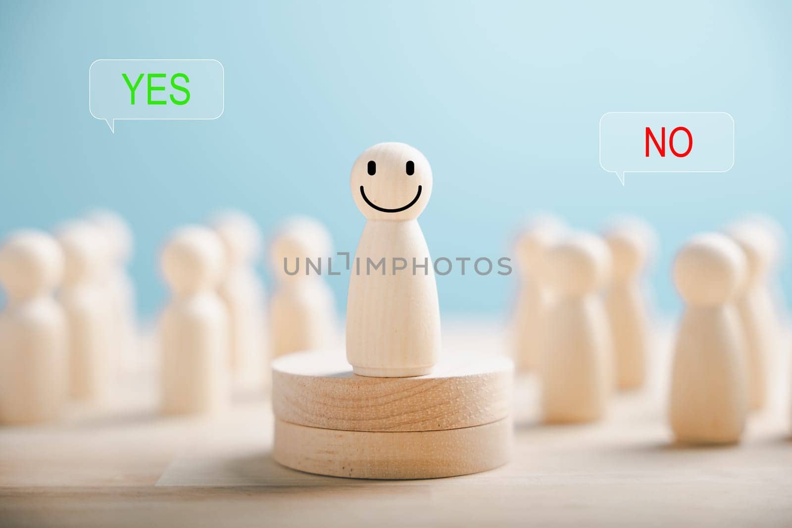 Wooden figures on a cube display yes or no symbols. Depicts open-mindedness in elections involving volunteers and candidates. Think With Yes Or No Choice. by Sorapop