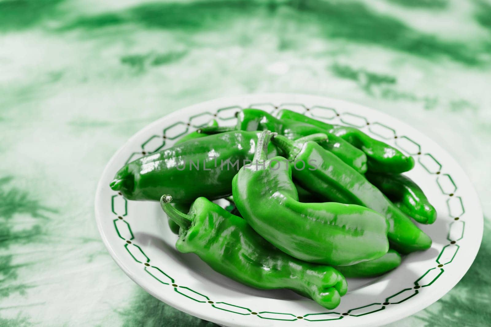 Green peppers , friggitelli , on plate by victimewalker