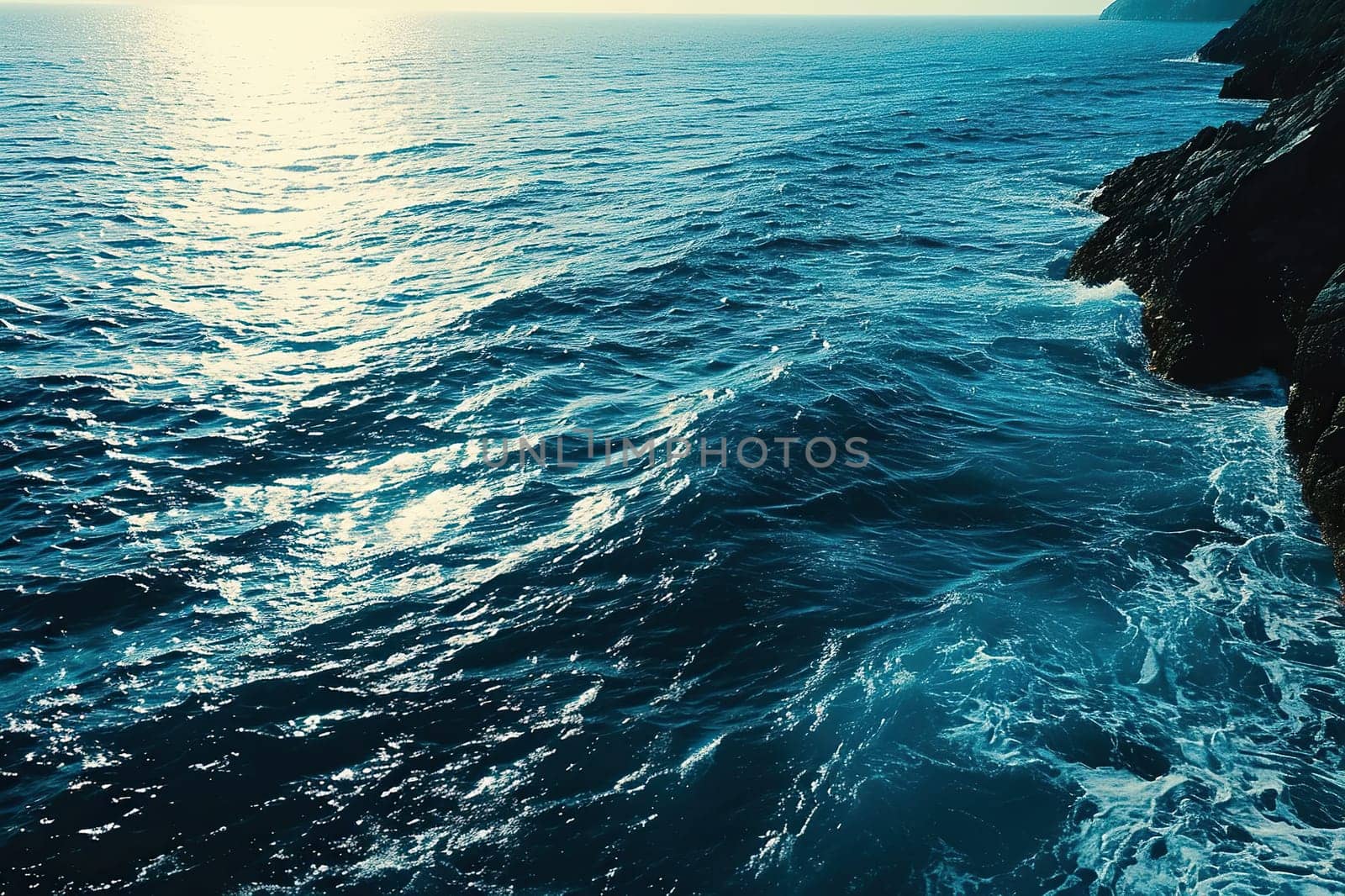 Top view of a calm sea with a rocky shore. Beautiful seascape.