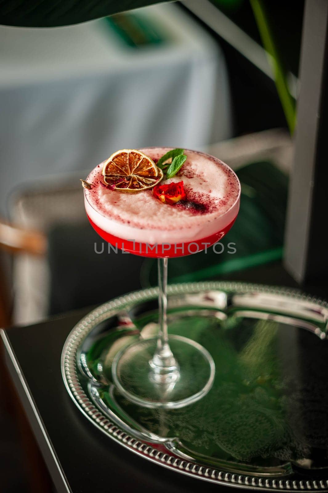 Pink lady alcoholic cocktail drink with gin, grenadine syrup and lemon juice by bizzyb0y