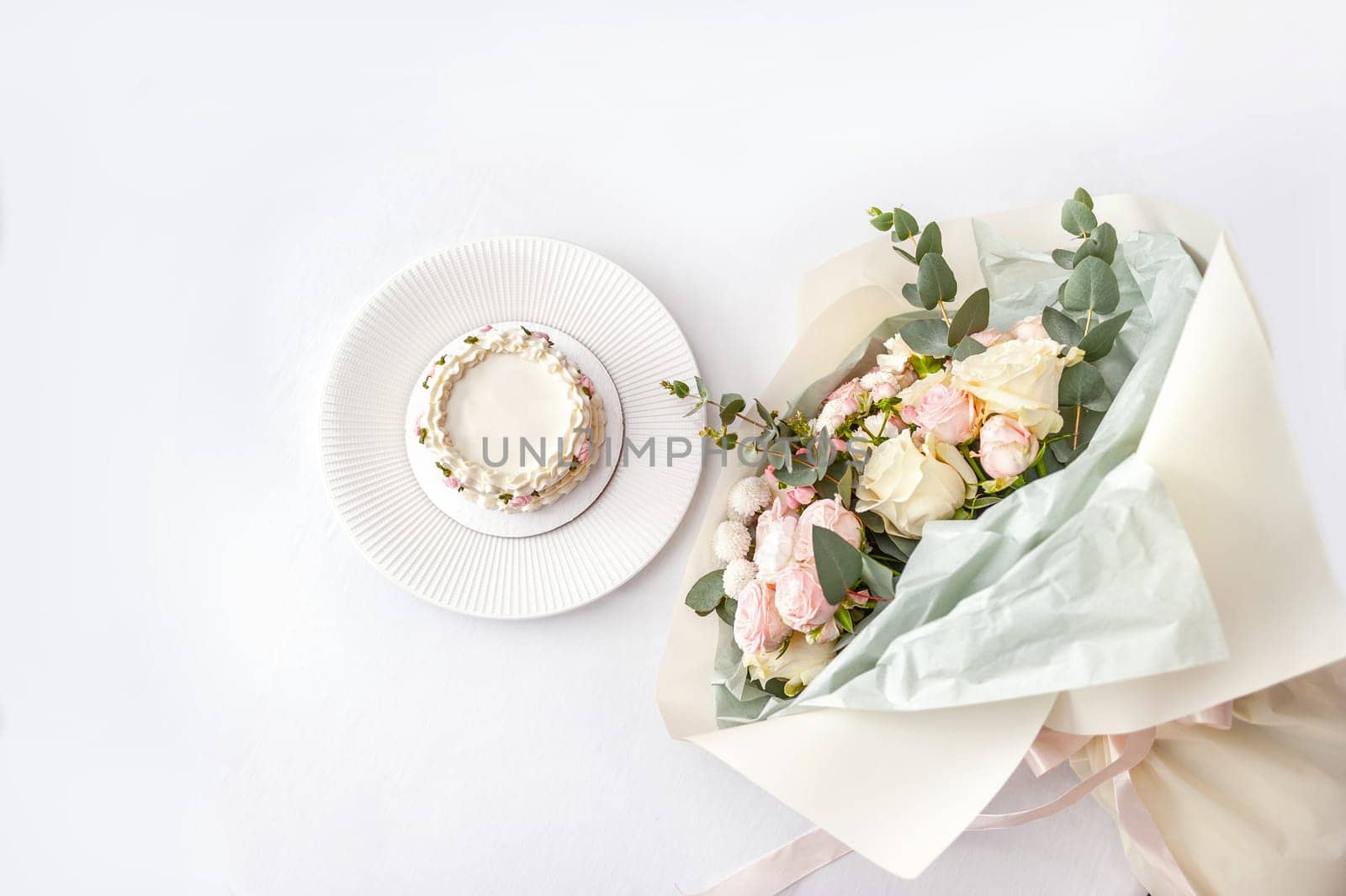 Festive bento cake and bouquet on a light background by bizzyb0y