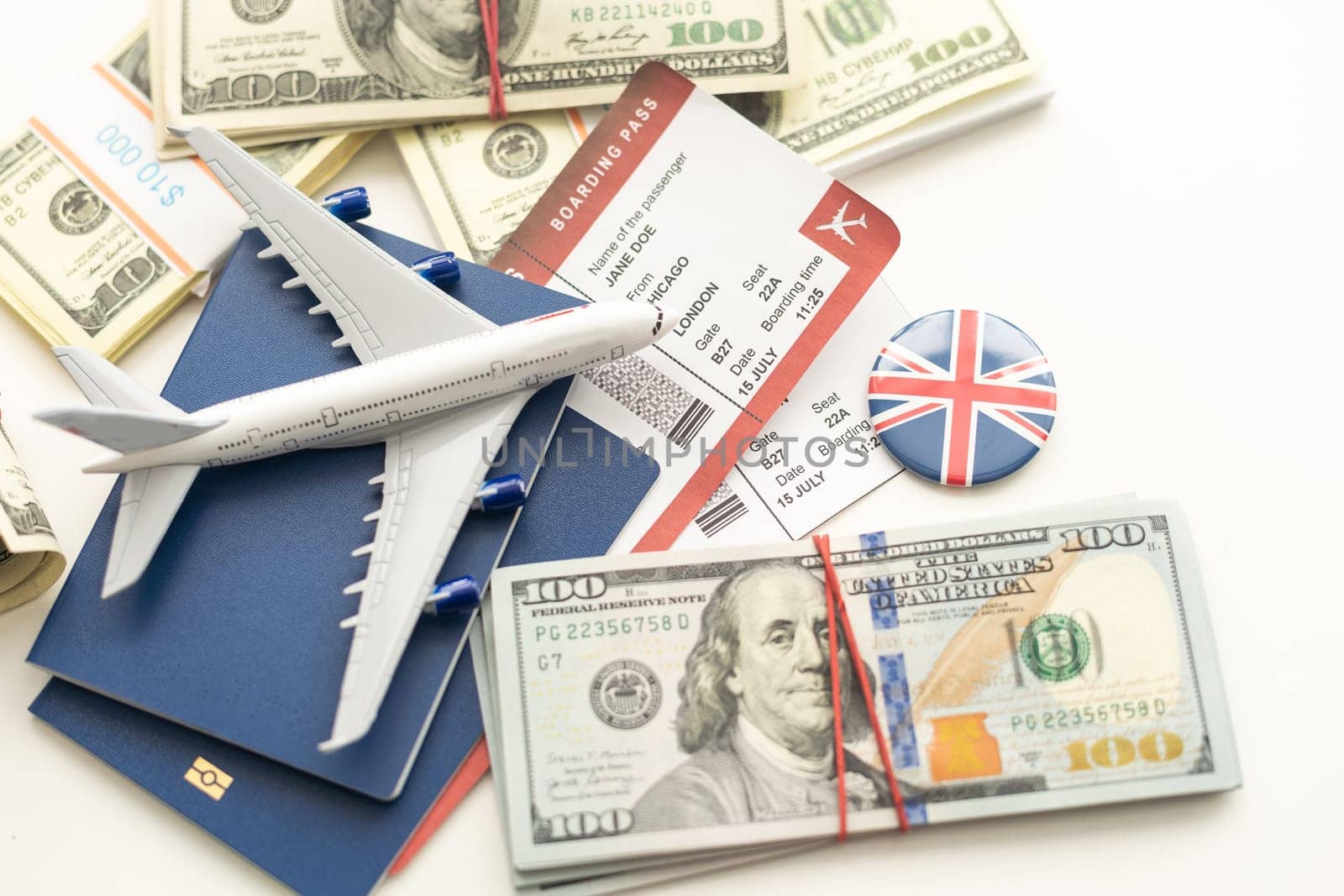 Airplane and money. Plane on the background of USA dollars. The cost of travel, air tickets and flights, financial expenses for vacation. by Andelov13