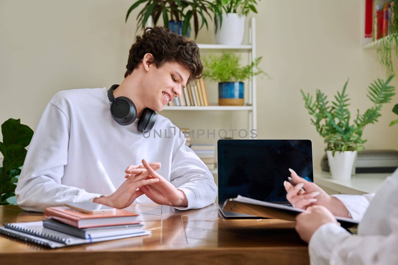 Young man university college student at meeting with female professional mental therapist, social worker, counselor, behavior. Psychology therapy help counseling treatment support, mental health