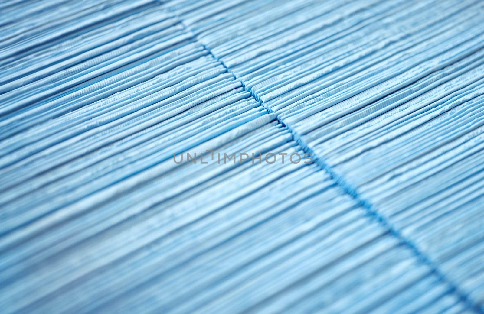 Blue disposable medical wipes in box closeup by kuprevich